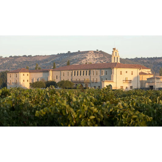 Restored medieval abbey at sunrise in Sardón de Duero