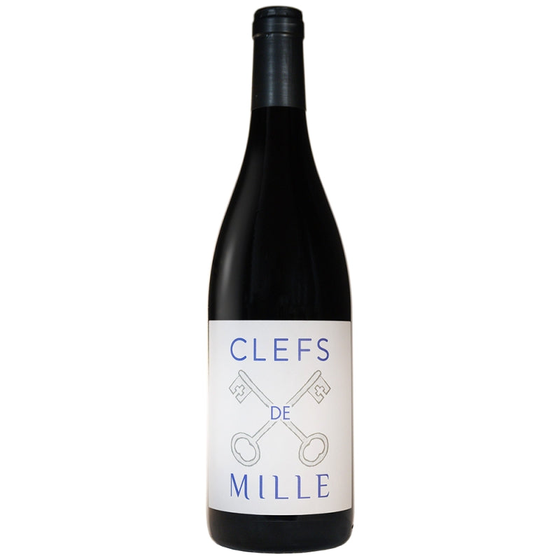 Bottle of Château de Mille Les Clefs de Mille Rouge 2023 – a certified organic red blend from Luberon, France, featuring a sleek label and deep ruby hue, surrounded by Provençal herbs and ripe berries.
