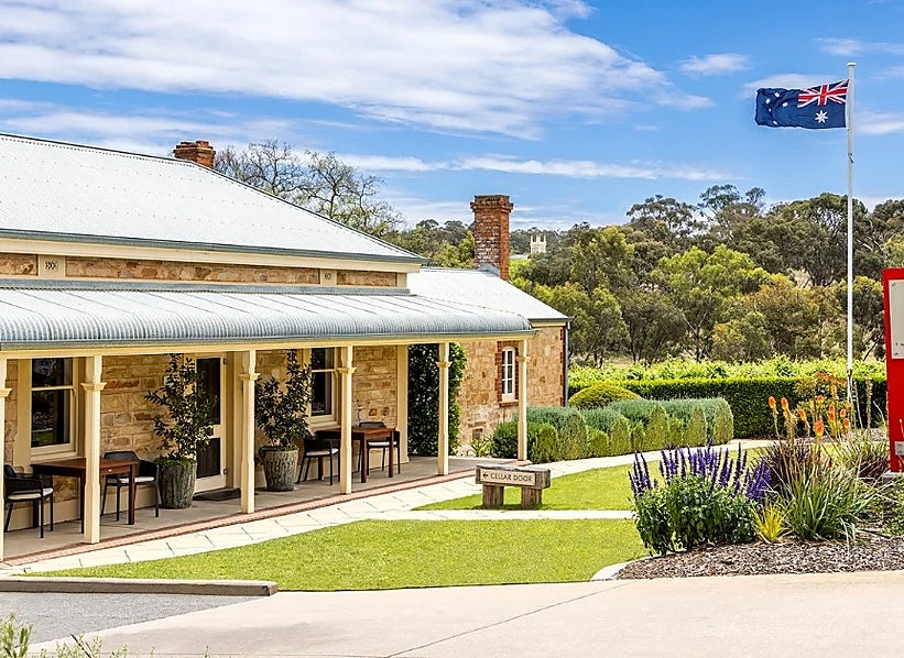 Stone cellar door with garden, Australian flag, and Two Hands Wines sign
