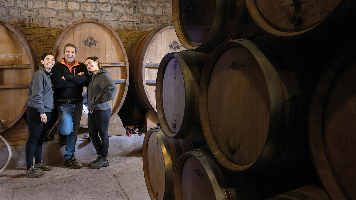 Jean-Claude Ramonet with daughters Anne-France and Clarisse in the family cellar in Chassagne-Montrachet, Burgundy — photo via Wine Spectator