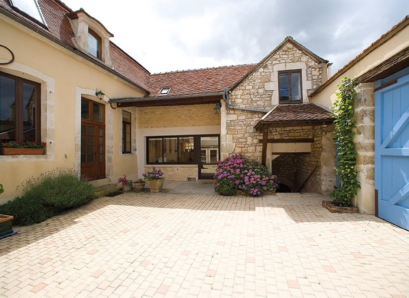 Stone courtyard of Jean and Sébastien Dauvissat winery in Chablis France