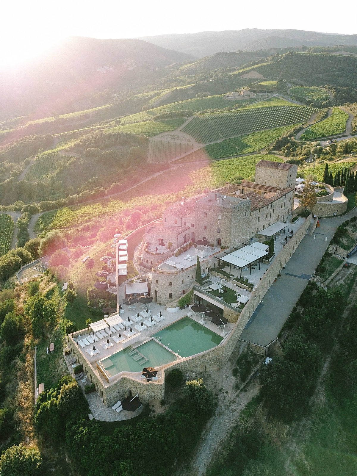 Aerial view of Castello di Velona and surrounding vineyards in Montalcino — photo by Milano1997, CC BY-SA 4.0