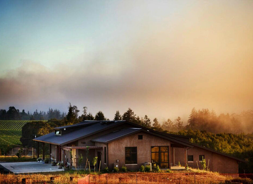 Littorai estate winery at sunset among coastal California vineyards