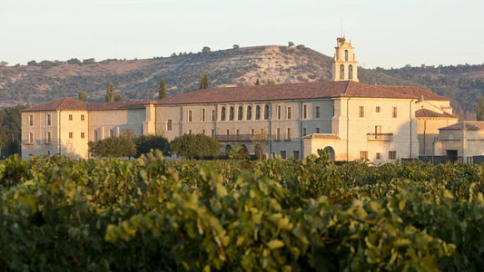 Restored medieval abbey at sunrise in Sardón de Duero